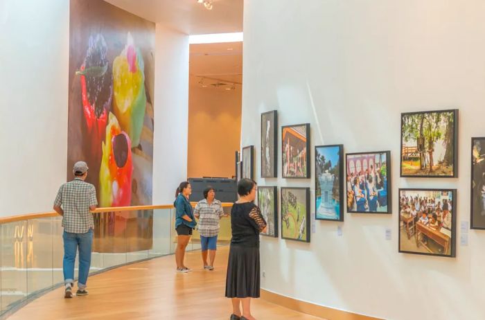 Art enthusiasts admire the exhibits at the Bangkok Arts and Culture Center.