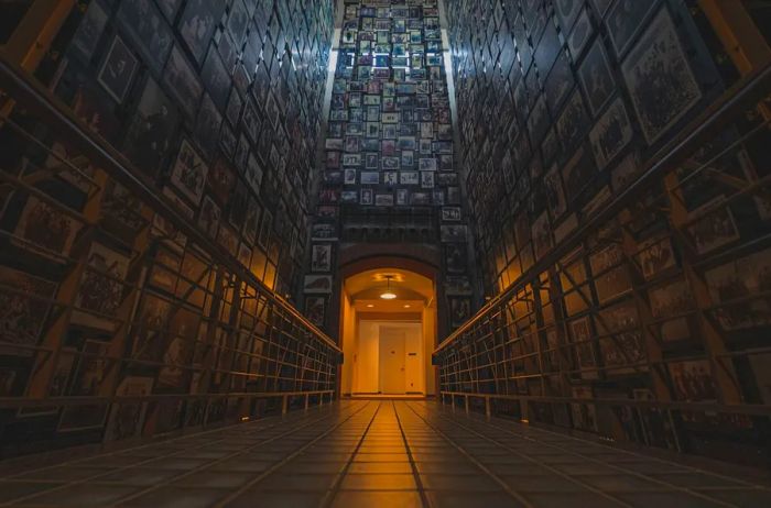 Interior view of a dimly lit room with high ceilings at the Holocaust Memorial Museum