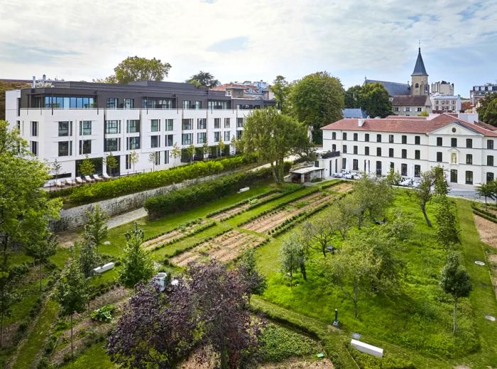 Aerial view showcasing the gardens and trees of Domaine Reine Margot Paris Issey.