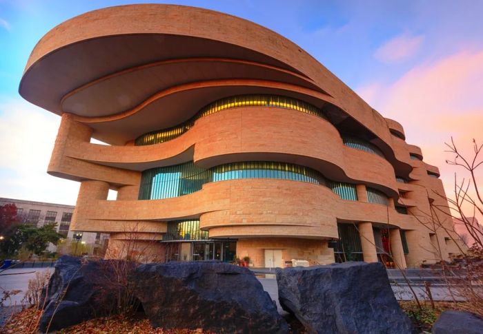 The curvilinear, terra-cotta exterior of the National Museum of the American Indian.