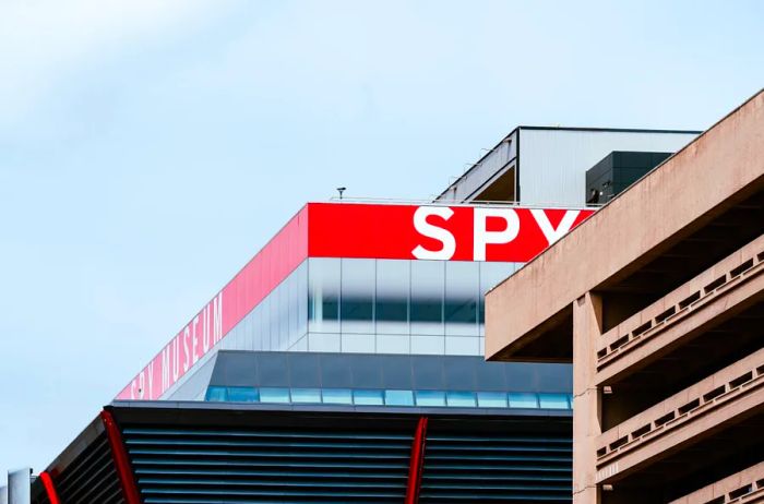 Red and white signage of the International Spy Museum