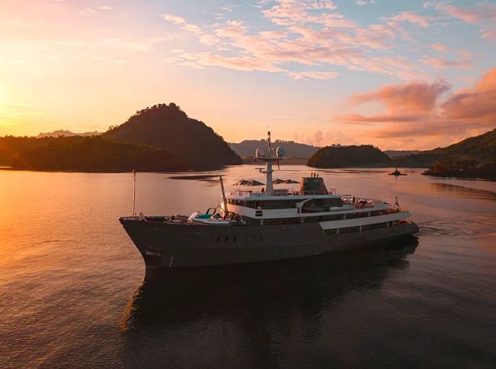 Aqua Blu, a luxury yacht, gracefully sails through the stunning Spice Islands of Indonesia.