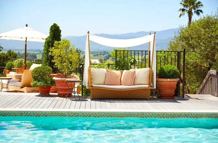 The outdoor pool at Auberge du Soleil features a row of cabanas.