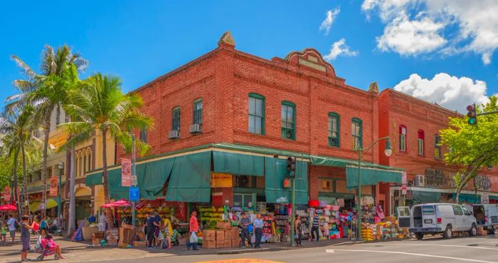 Shoppers browsing for groceries outside a charming red brick building.