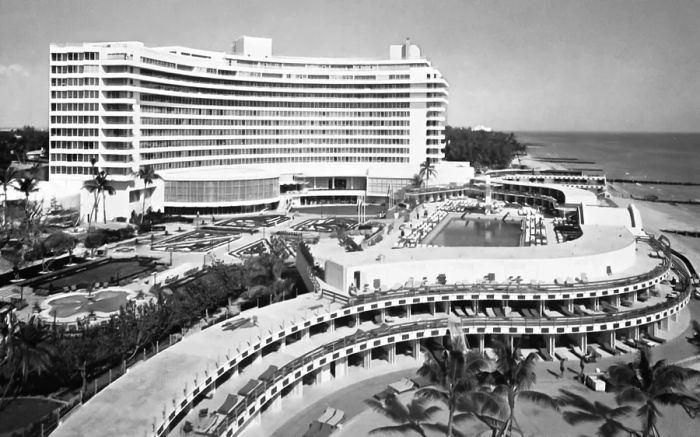 A black-and-white photograph from 1969 captures the curvilinear exterior of Fontainebleau Miami Beach.