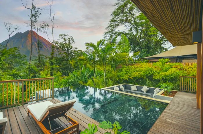 Nayara Casa Paloma features a pool with a stunning view of the Arenal Volcano