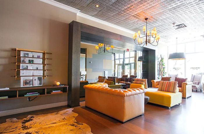 The lobby of The Wydown Hotel boasts ample natural light and oversized couches for a cozy atmosphere.