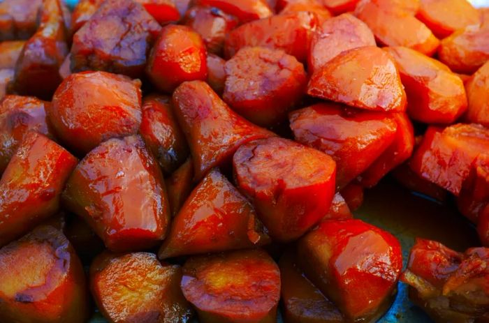 A close-up of camote enmelado, a sweet Mexican dessert made from honeyed sweet potato.