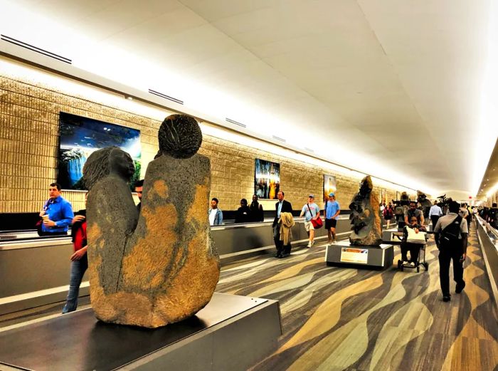 Art installations adorn a corridor at Hartsfield-Jackson Atlanta International Airport.