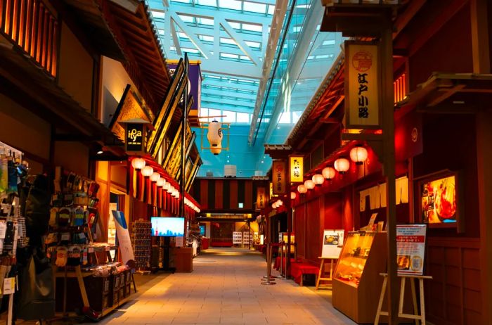 Haneda's Terminal 3 features the Edo marketplace, showcasing a variety of shops and restaurants with traditional Japanese aesthetics.