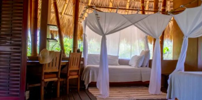 The private casita at Playa Viva features a thatched roof, along with a dining room and a balcony for your enjoyment.