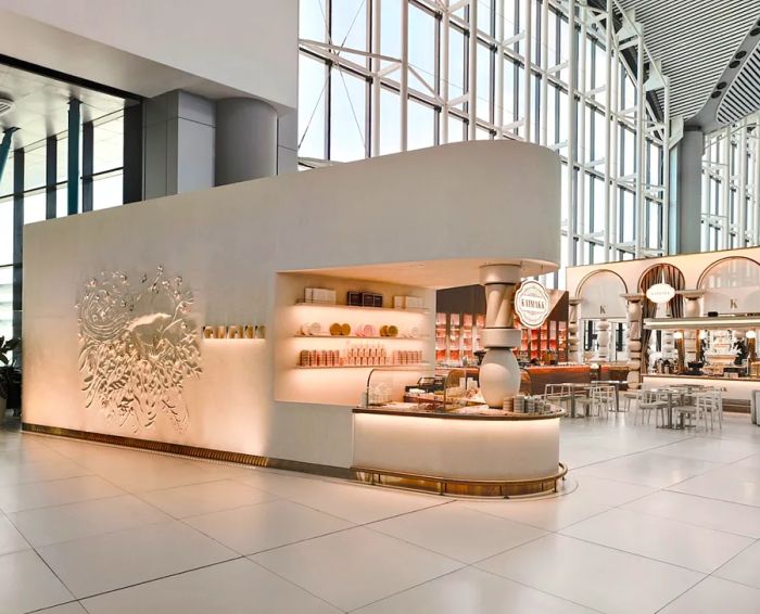 Kaimakk at Istanbul Airport presents a stylish setting with predominantly white design elements, serving delicious Turkish delights.