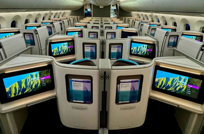 A row of vacant seats in Hawaiian Airlines' newly designed business-class cabin, highlighting the 1-2-1 seating arrangement