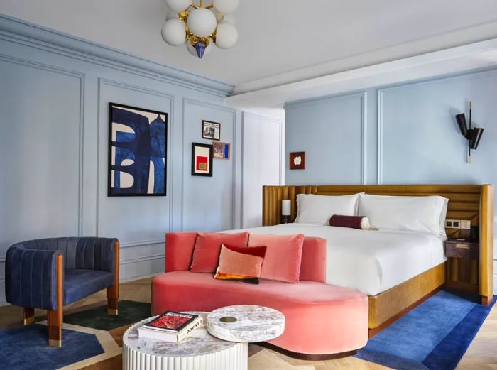 Guest rooms at W Rome feature a harmonious blend of colors, specifically soft blues and pinks.