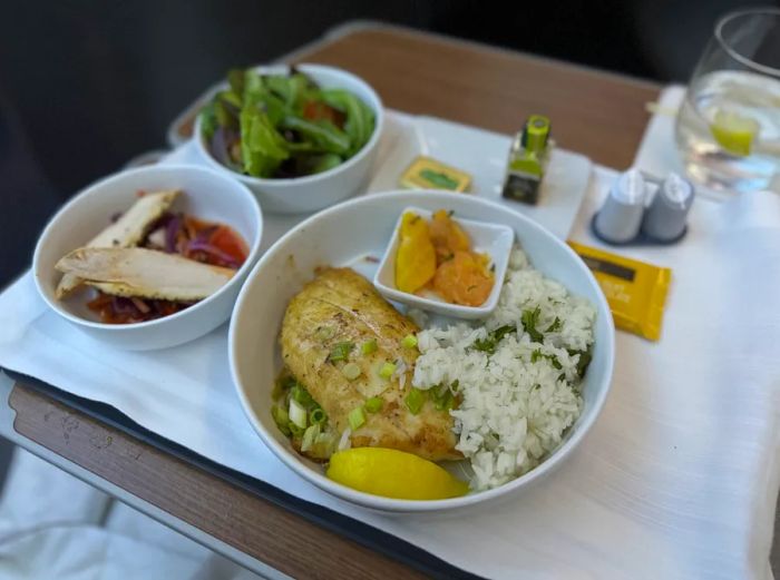 Barramundi dish served with rice in American Airlines' business class.