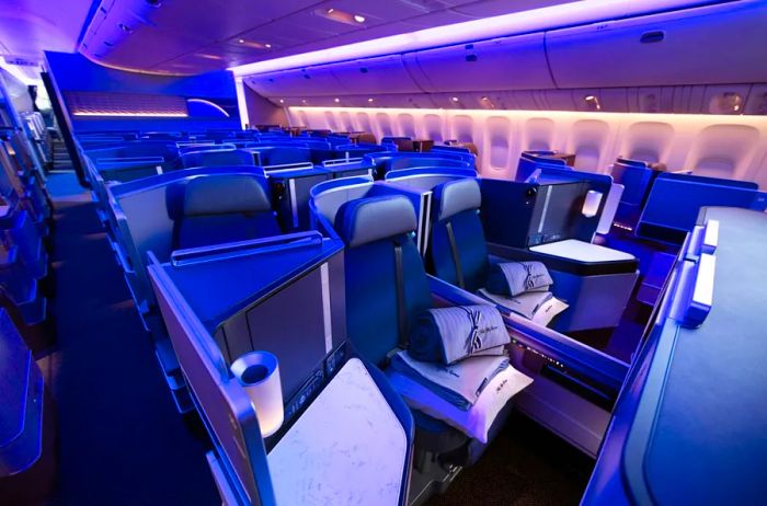 Purple lighting illuminates United's Polaris business class seats.