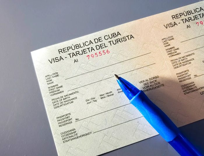 Cuban Tourist Card featuring a blue pen