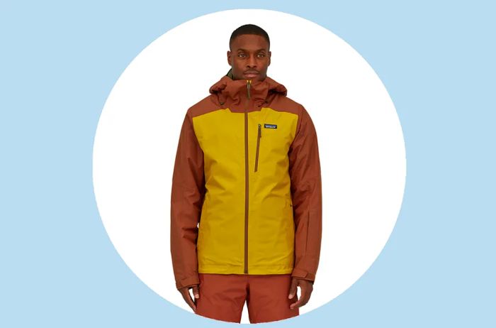 Man sporting a vibrant yellow and orange Patagonia ski jacket