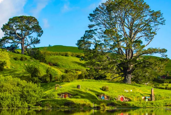 The iconic round doors of Hobbit Holes nestled into the hillside.