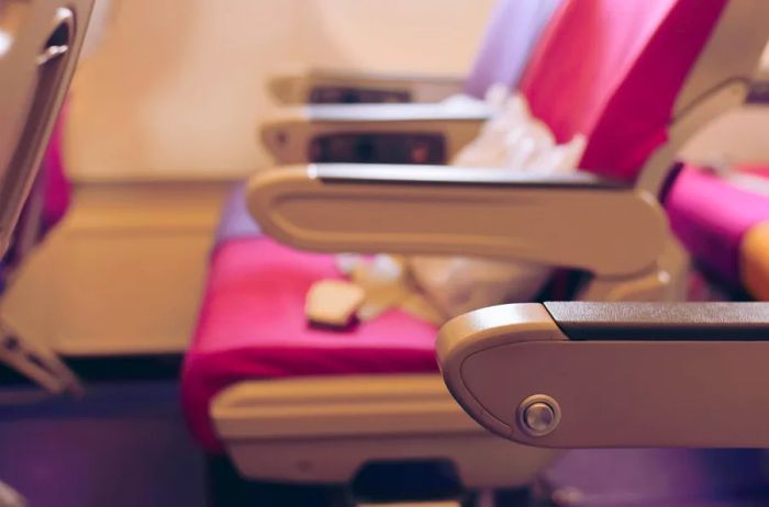 A close-up shot of a row of unoccupied seats on an airplane