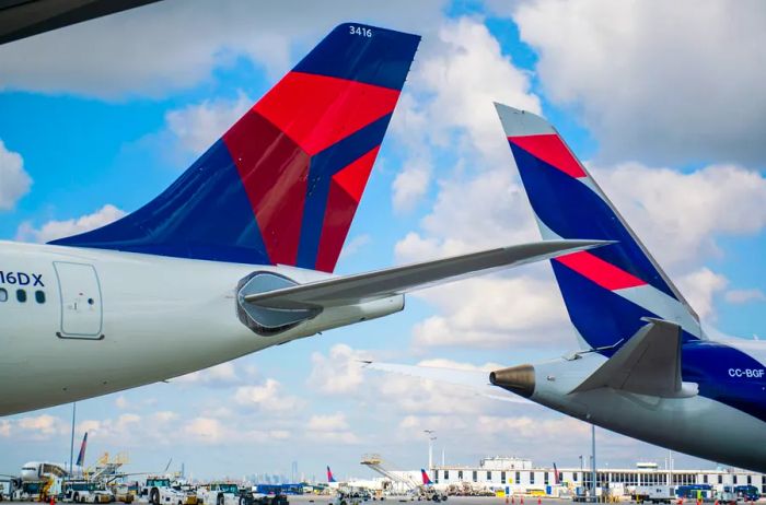 the tails of two Delta and Latam aircraft