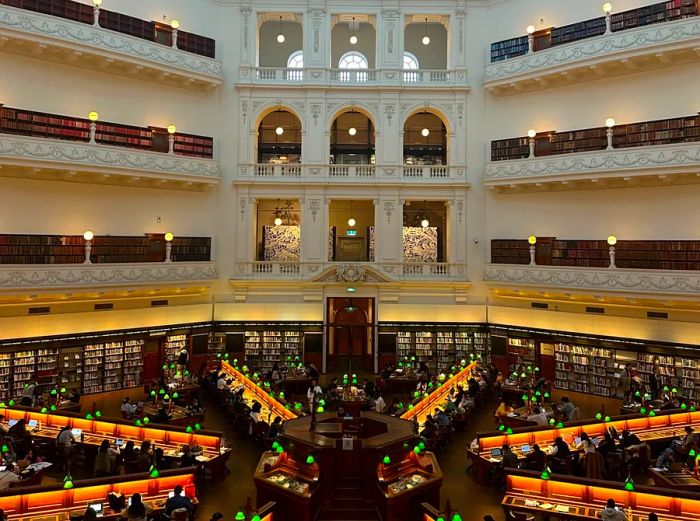 Aerial view of rows of desks arranged in spoke formation at Melbourne's State Library Victoria.