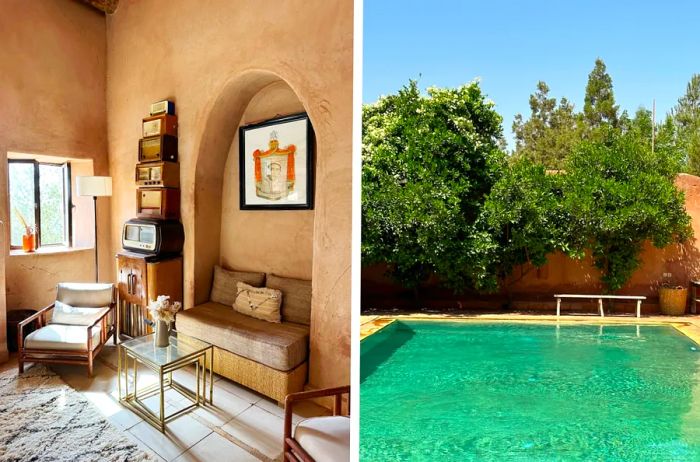 Kasbah Bab Ourika features rooms adorned with thick patterned rugs and warm, sandy walls. The large pool, framed by pink walls and lush trees, offers a serene escape.