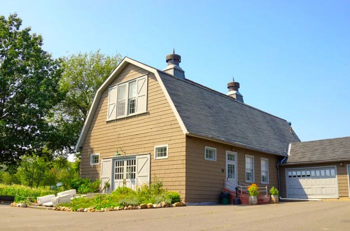 A reconstructed tan barn located at Queens County Farm in Queens.