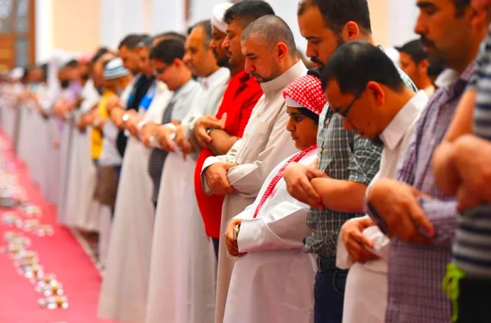 Muslim men engaged in prayer