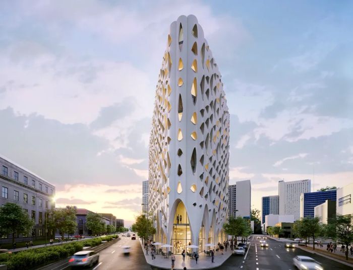 A flatiron-shaped building with irregular windows and white walls designed to resemble an aspen tree