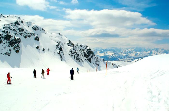 A group of six skiers navigating the slopes high in the Alps, Montgenèvre