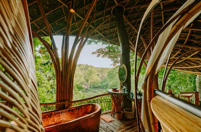 Bambu Indah features accommodations crafted from restored teak bridal houses and includes luxurious copper bathtubs.