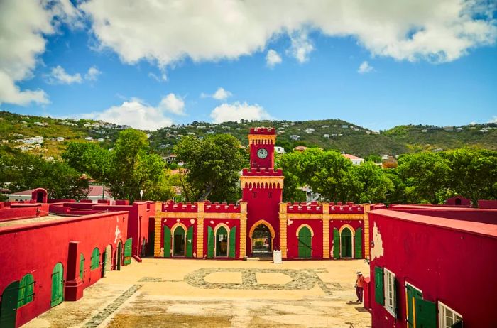 The interior courtyard of the vibrant red, green, and yellow Fort Christian in St. Thomas.