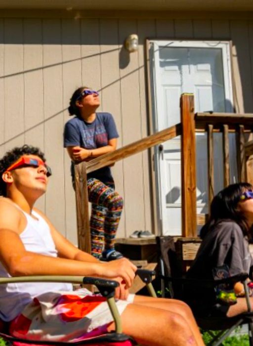 A family gathers in Kerrville, Texas to witness the annular solar eclipse on October 14, 2023.