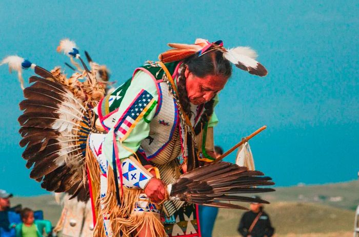 A Lakota man in South Dakota wearing traditional attire.