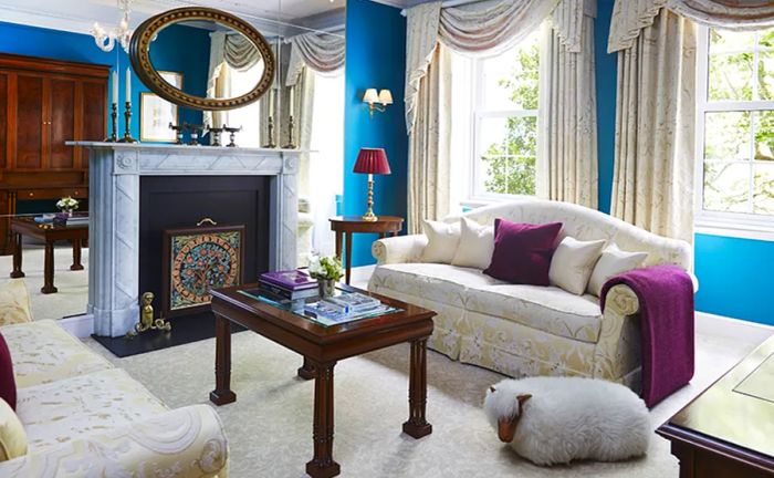 The Goring's Belgravia Suites boast fireplaces and vibrant accents in shades of blue and purple.