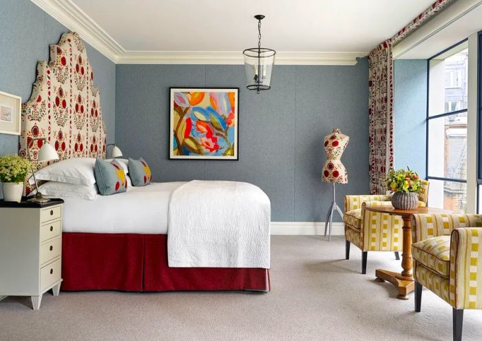 The interior of a Ham Yard guest room, vibrant with bright colors and patterns