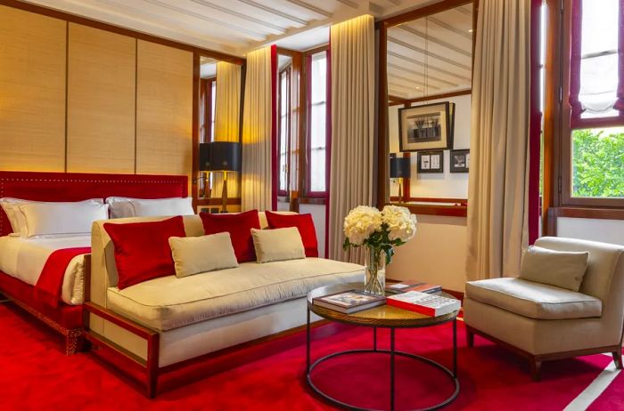 The interiors of the guest rooms feature striking accents of cardinal red.