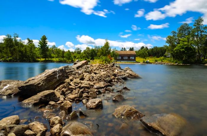 A distinctive view of a stone pathway leading to a cabin on Moosehead Lake in Rockwood, Maine.