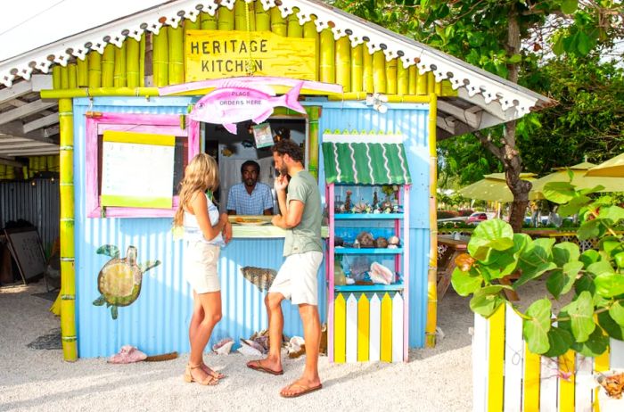 Two diners enjoying a meal at Heritage Kitchen in the Cayman Islands