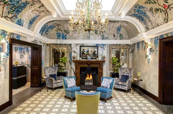 The walls and ceilings of this lounge area at Brown's Hotel are adorned with floral designs.