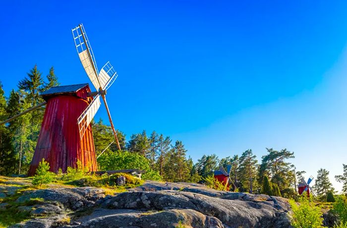 A classic Åland windmill on a rocky hillside