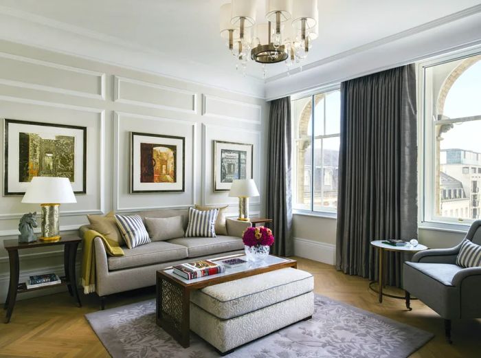 The Langham London's one-bedroom suite features a spacious seating area filled with natural light.