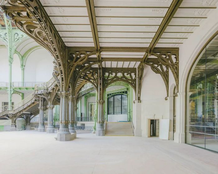 Vacant interior of the Grand Palais, featuring metal columns