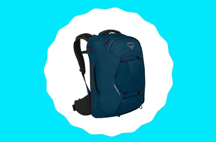 A deep blue travel backpack featuring striking red zippers