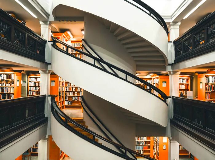 A stunning white spiral staircase in the public library located in Helsinki, Finland