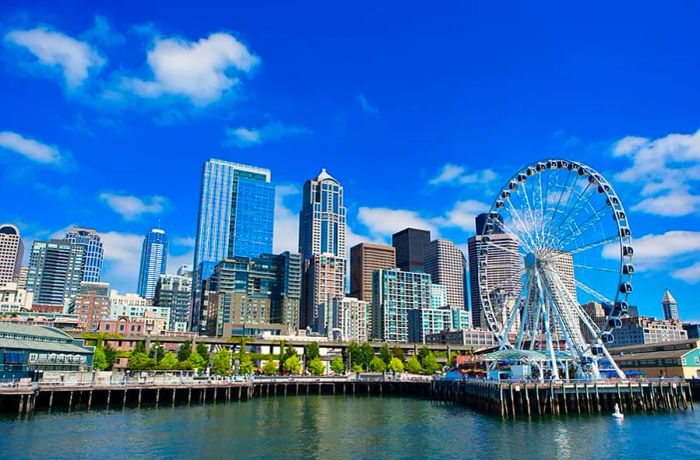 The Seattle waterfront, showcasing the ferris wheel in the foreground, is a picturesque sight.