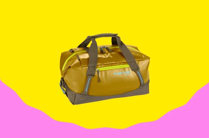 A mustard-gold water-resistant duffel bag with brown handles