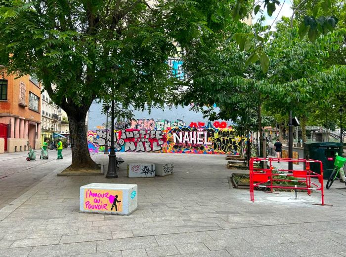 Graffiti in Paris honors the memory of a teenager who was killed by a police officer.