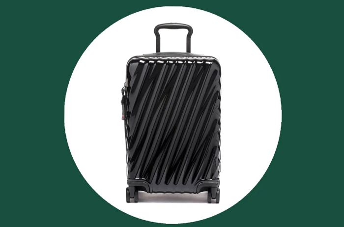 Tumi 19 Degree International Expandable 4 Wheeled Carry-On in black, featuring a unique wavy ridged exterior